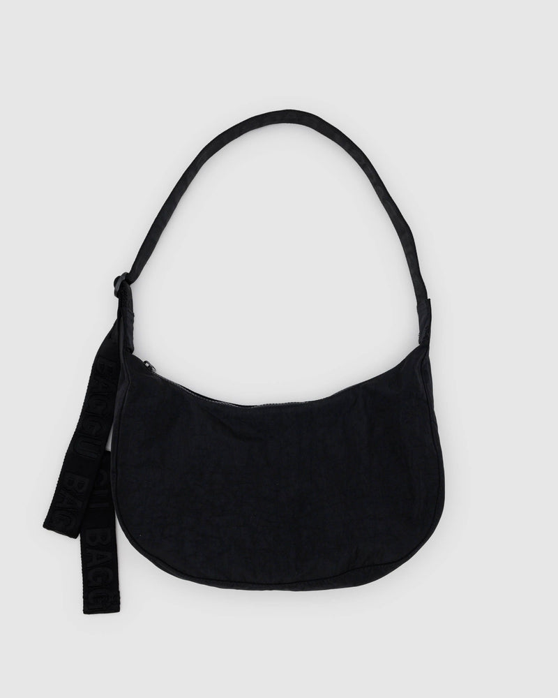 BAGGU.com Crossbody Bags A black nylon crescent-shaped handbag with an adjustable strap and a small logo on the exterior.